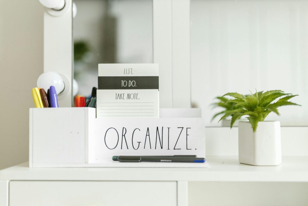 organized desk with sign that says organize