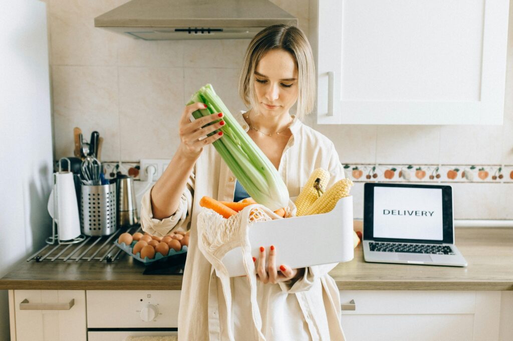 woman with bag of vegetables