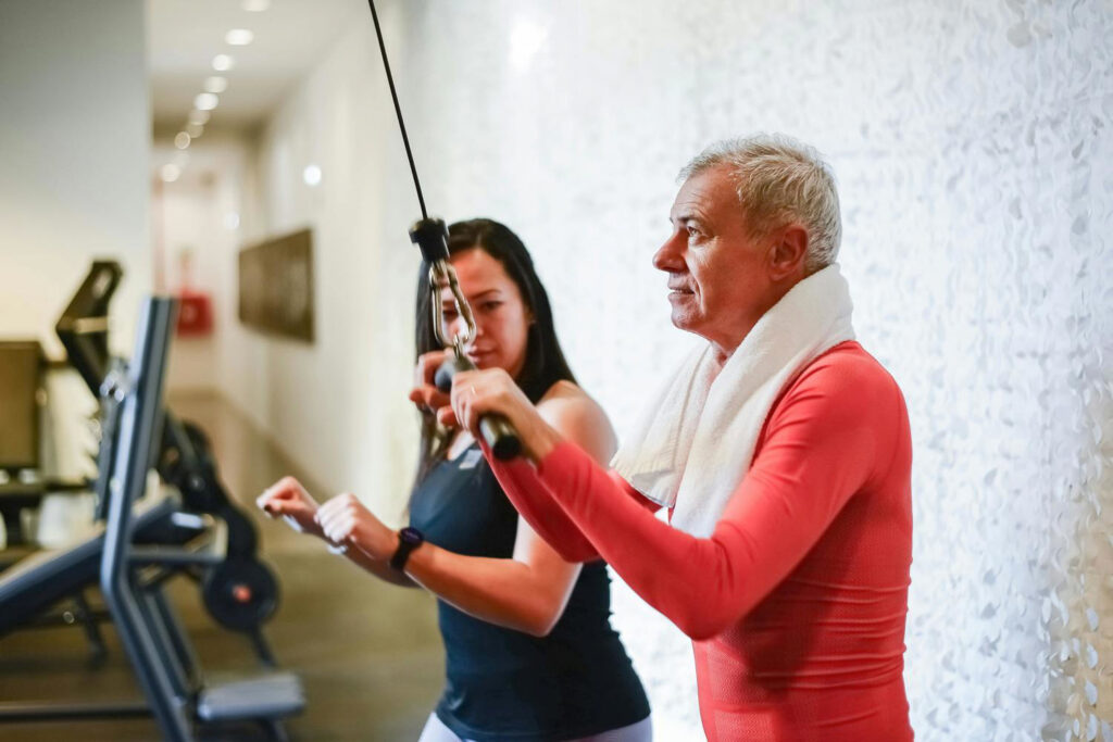 man working out with a trainer