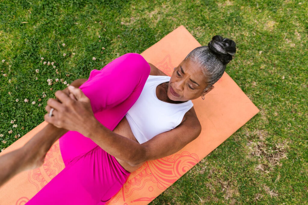outdoor shot of woman on yoga mat