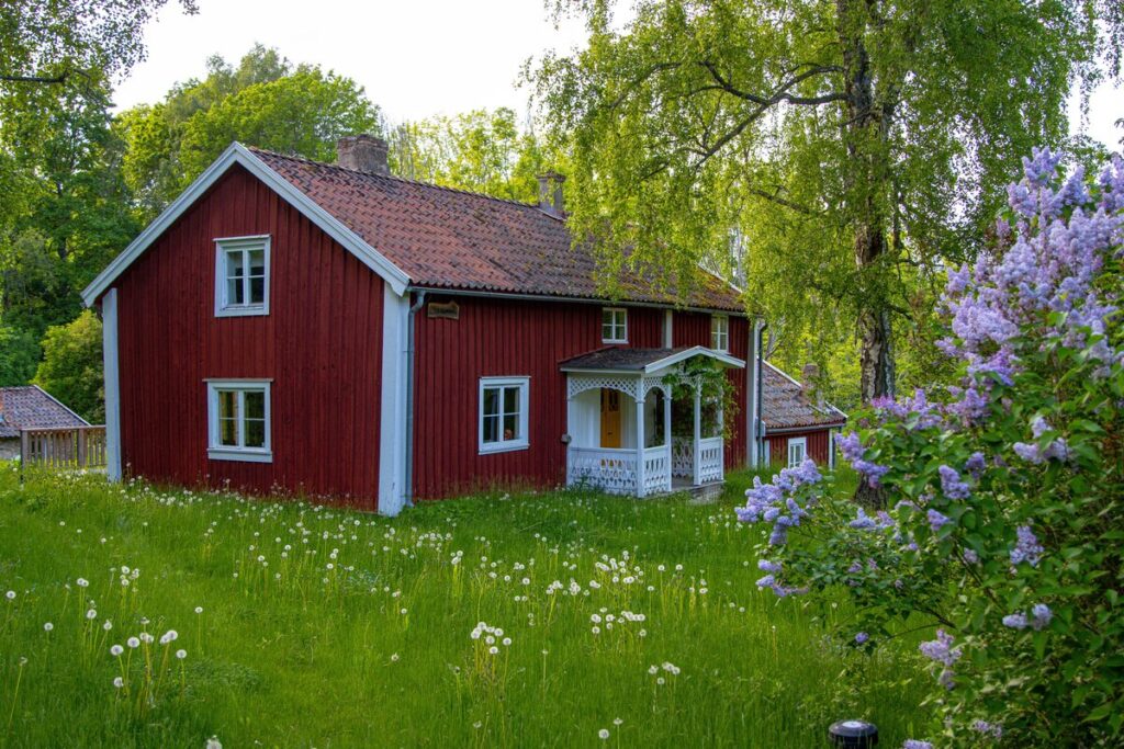 red Swedish country house in cottage garden