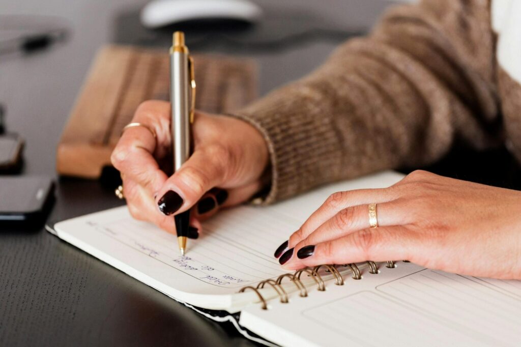 woman writing in journal