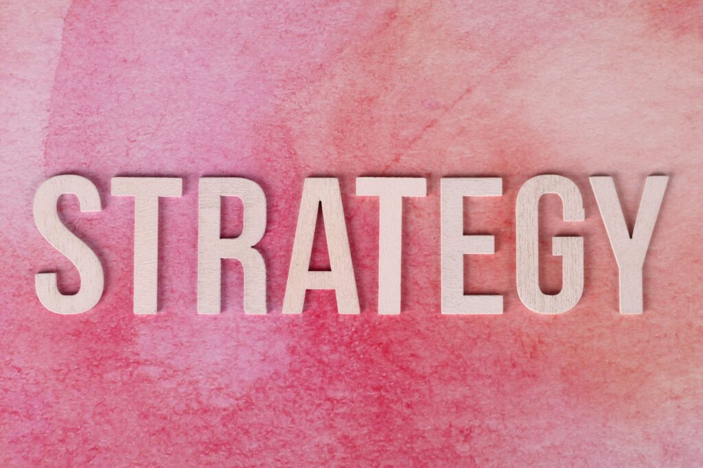 image with pinkish background reading STRATEGY